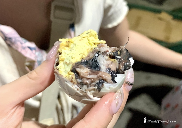 A half-eaten balut